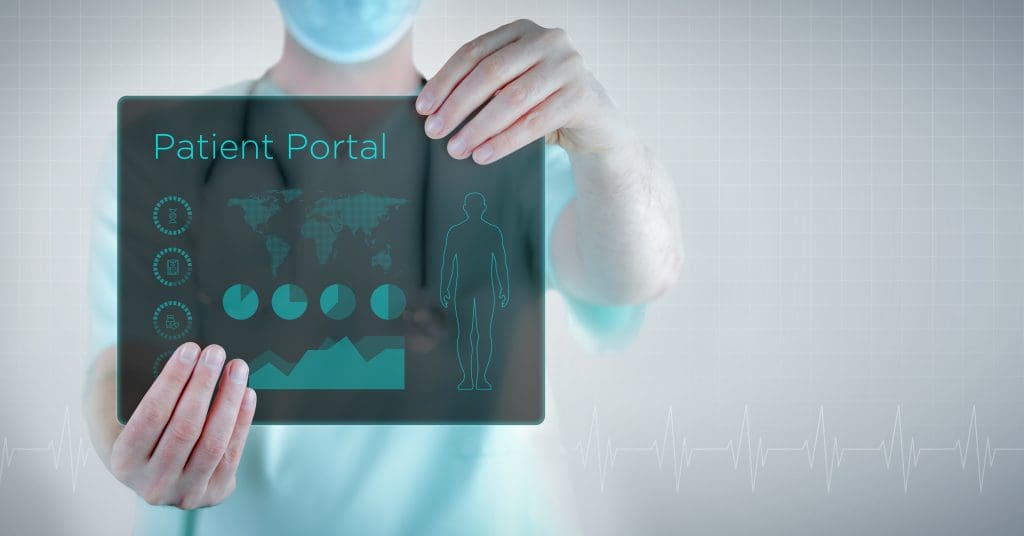 A doctor holding a tablet with a view of a patient portal