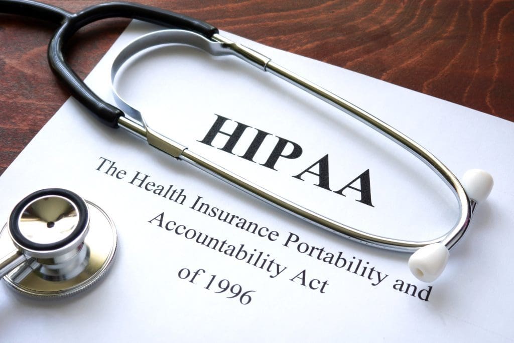 A paper that reads “HIPAA” with a stethoscope around it.