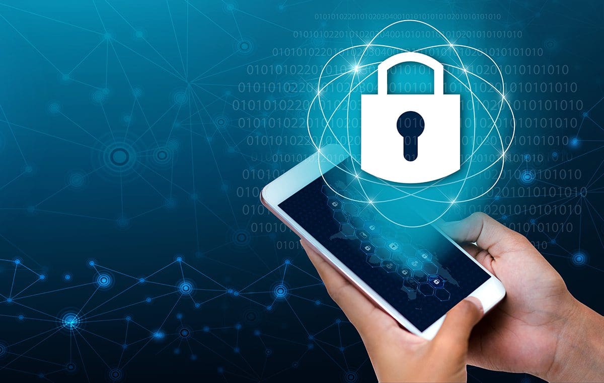 A person holding a cell phone with a digital image of a locked padlock above it.