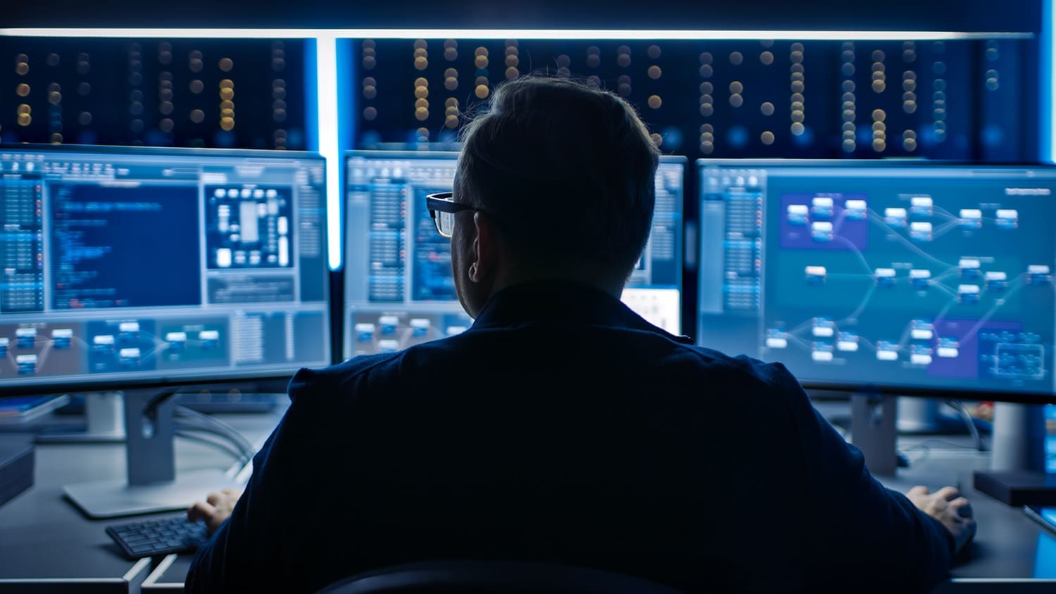 An IT staff member working on his computer.