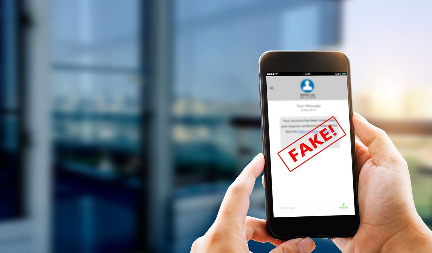 A phone showing a fake message warning