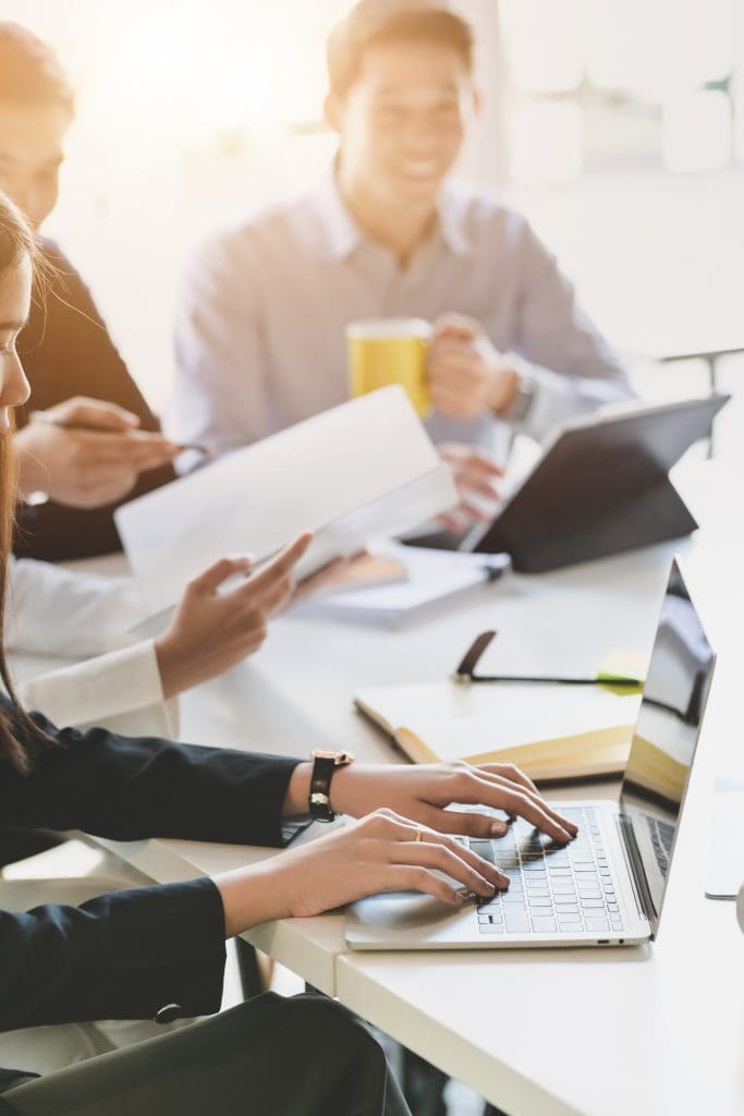 office workers using laptops
